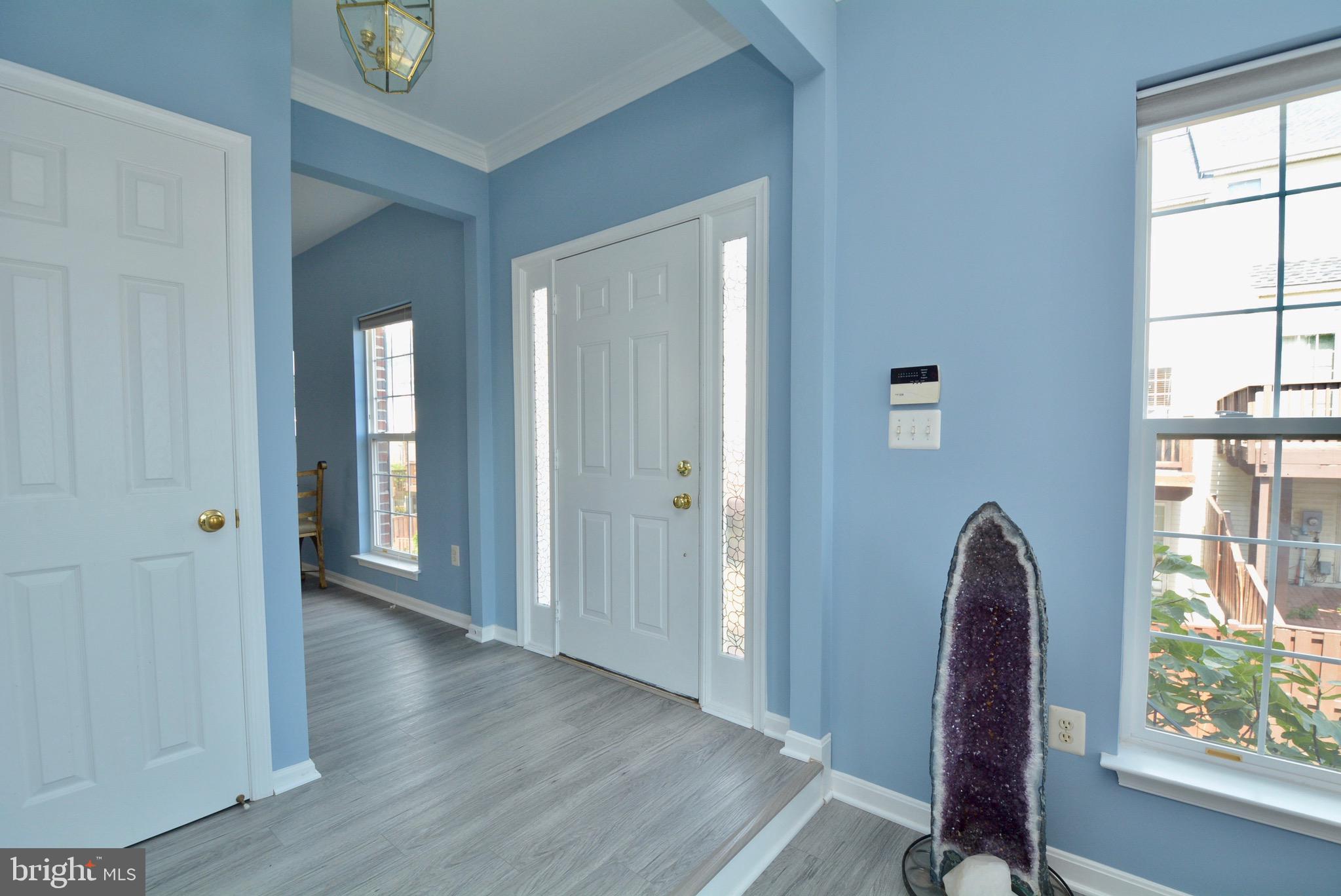 8361 Regal Oak Court Springfield, VA 22152 - Photo 3 of 43 Foyer with coat closet and half bath
