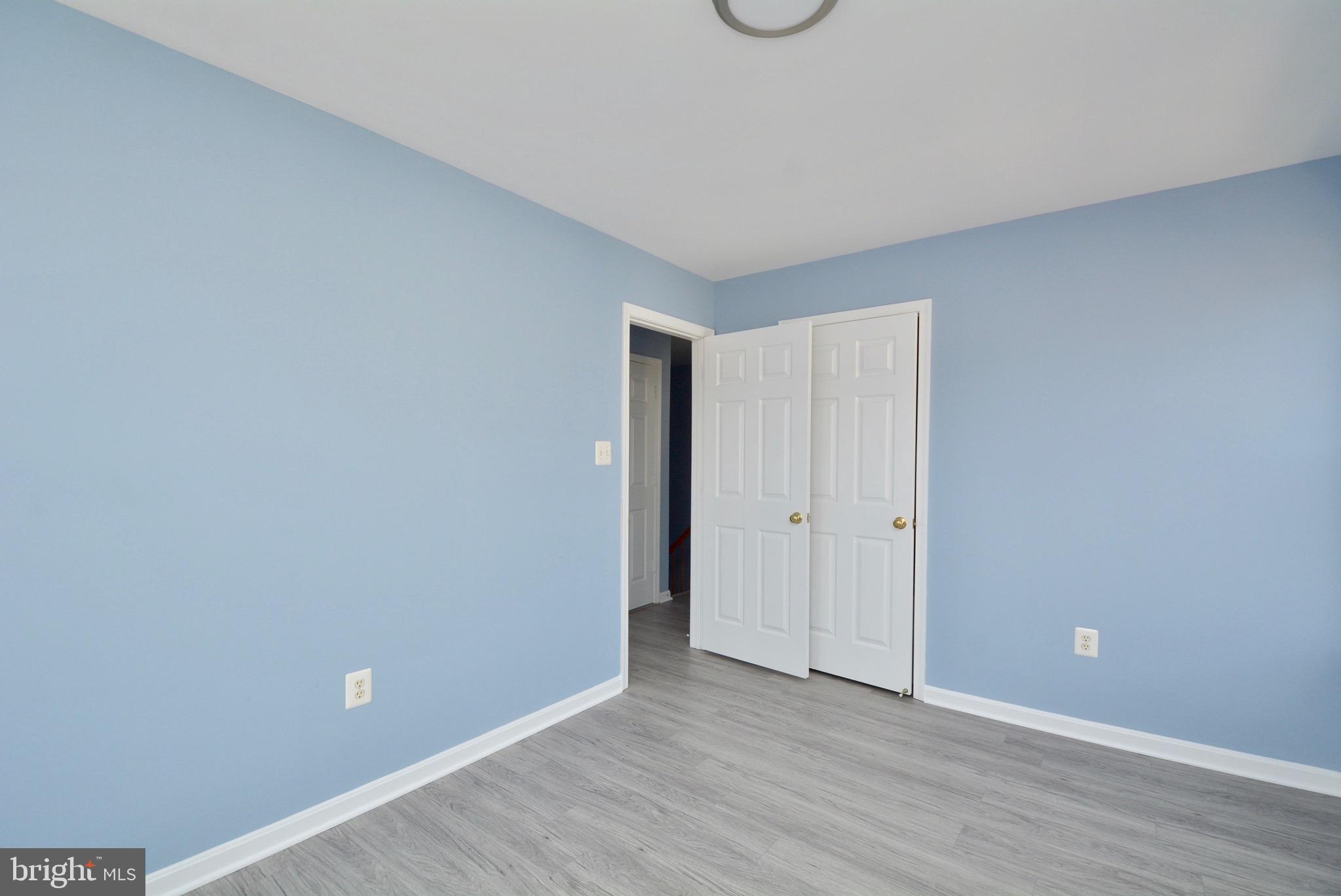 8361 Regal Oak Court Springfield, VA 22152 - Photo 24 of 43 Bedroom 2 with Brand new LVT, Paint, fixture