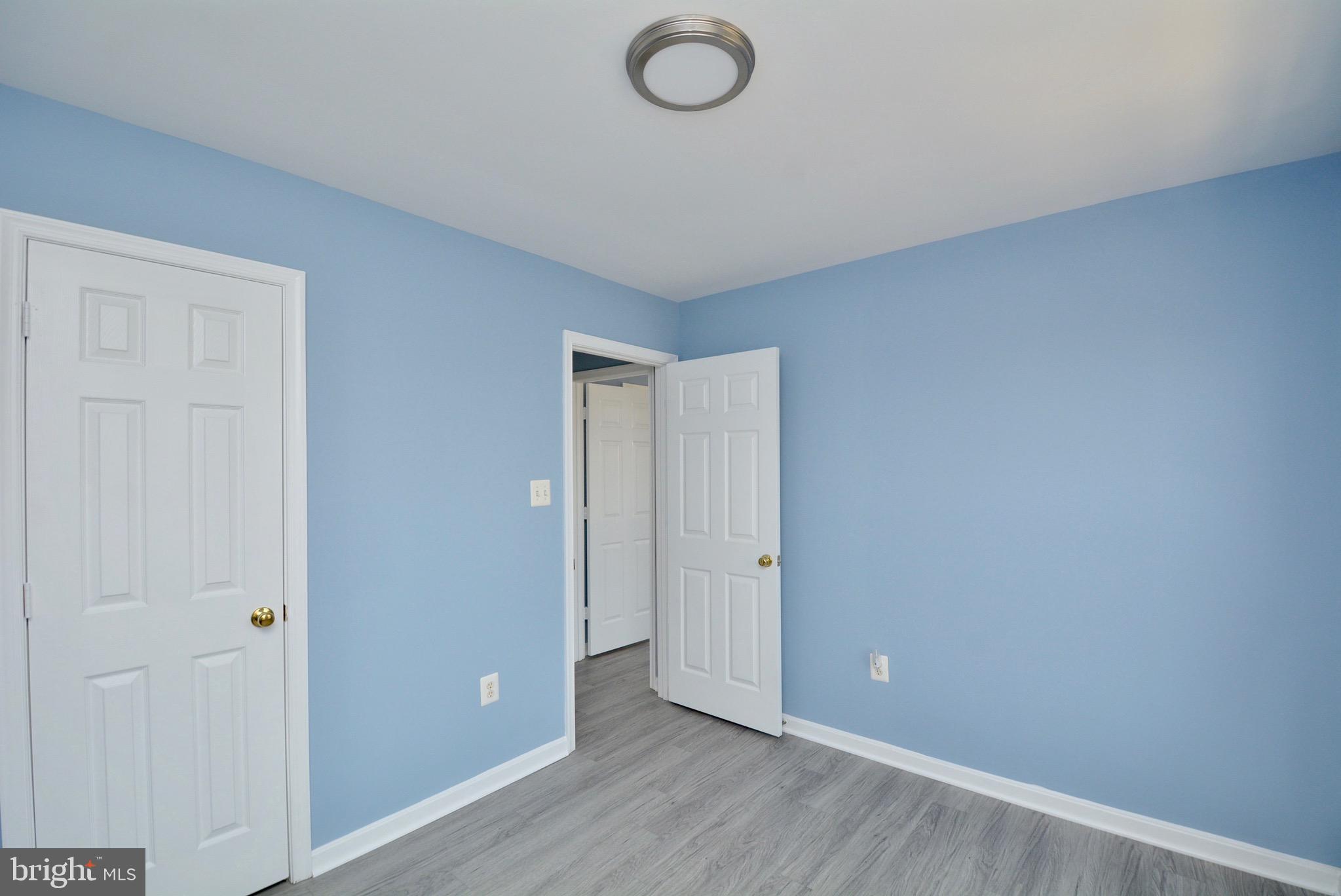 8361 Regal Oak Court Springfield, VA 22152 - Photo 26 of 43 Bedroom 3 with Brand new LVT, Paint, fixture