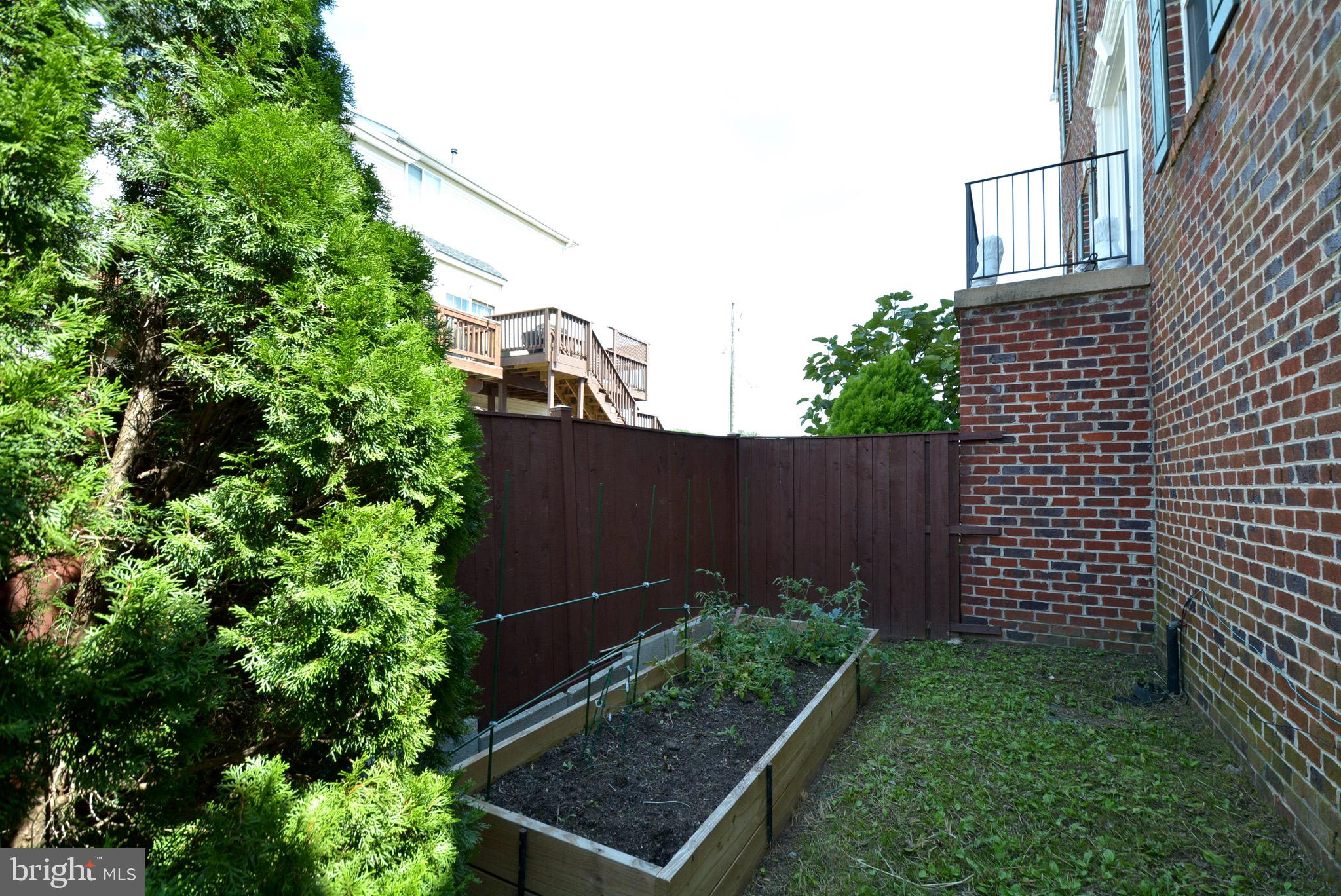 8361 Regal Oak Court Springfield, VA 22152 - Photo 40 of 43 Brick 2 sided with room for gardening. Fenced!