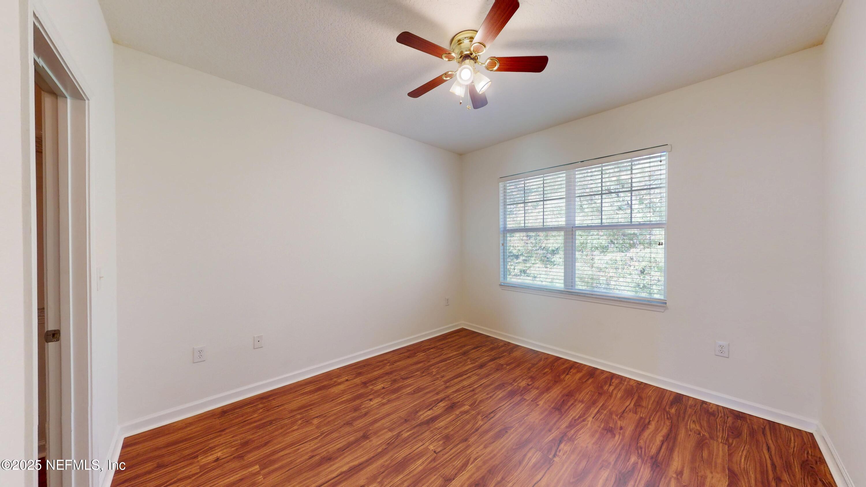 5663 Greenland Road, Unit 1004 Jacksonville, FL 32258 - Photo 12 of 35 an empty room with fan and windows