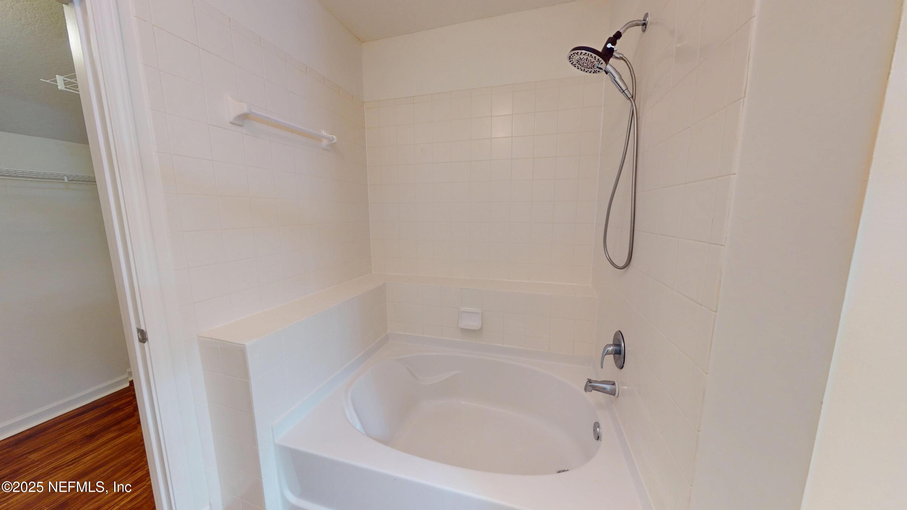 5663 Greenland Road, Unit 1004 Jacksonville, FL 32258 - Photo 24 of 35 a bathroom with a bathtub