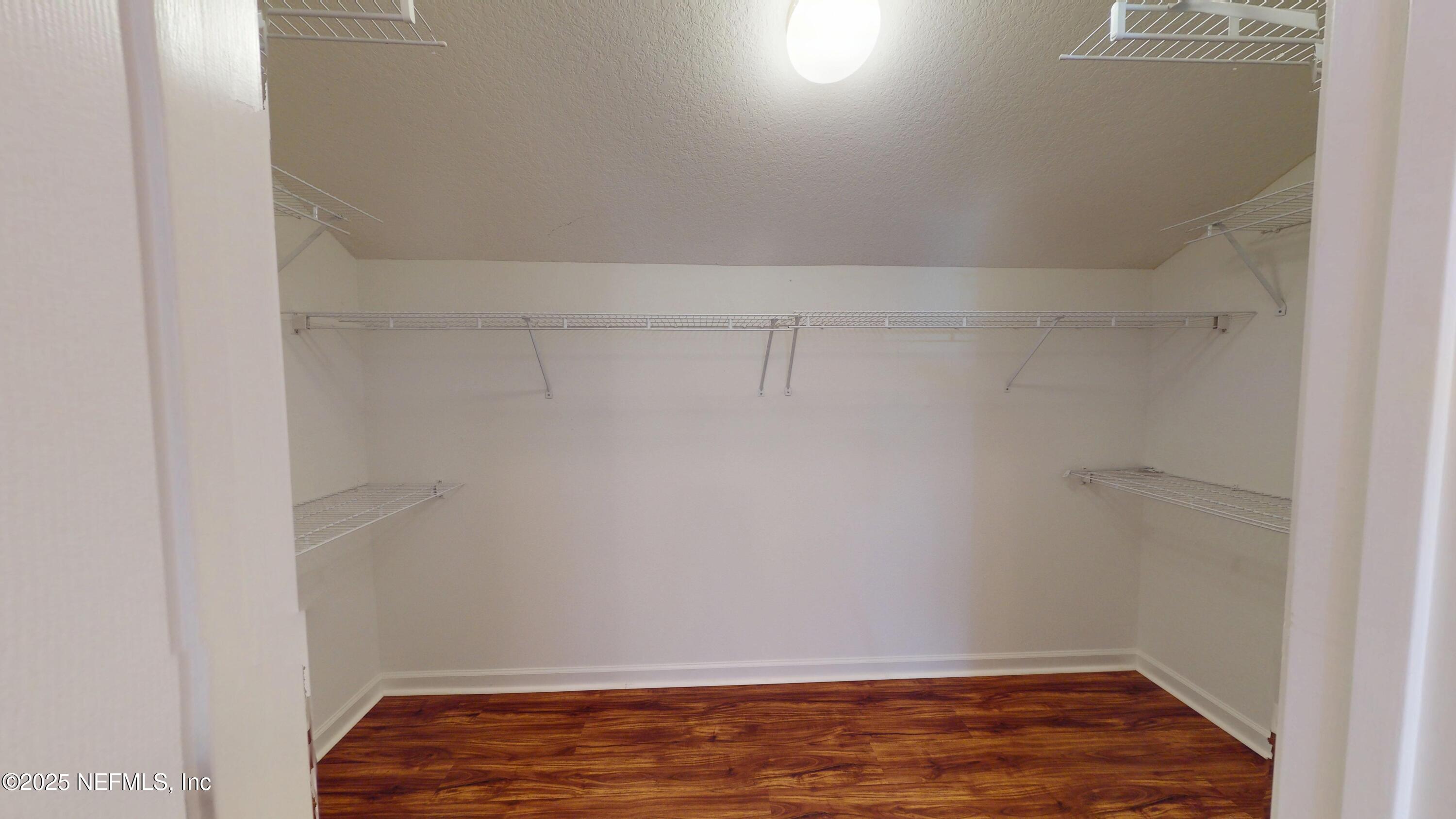 5663 Greenland Road, Unit 1004 Jacksonville, FL 32258 - Photo 25 of 35 a view of small space with racks on the wall