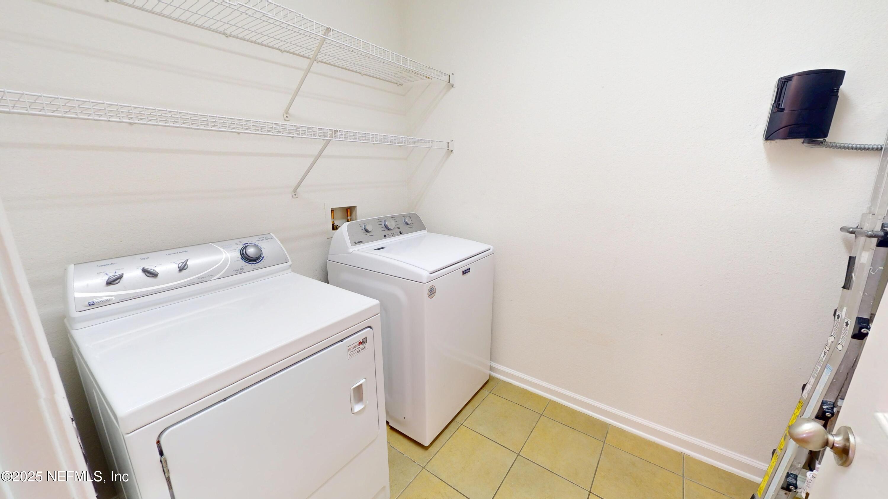 5663 Greenland Road, Unit 1004 Jacksonville, FL 32258 - Photo 27 of 35 a utility room with dryer and washer