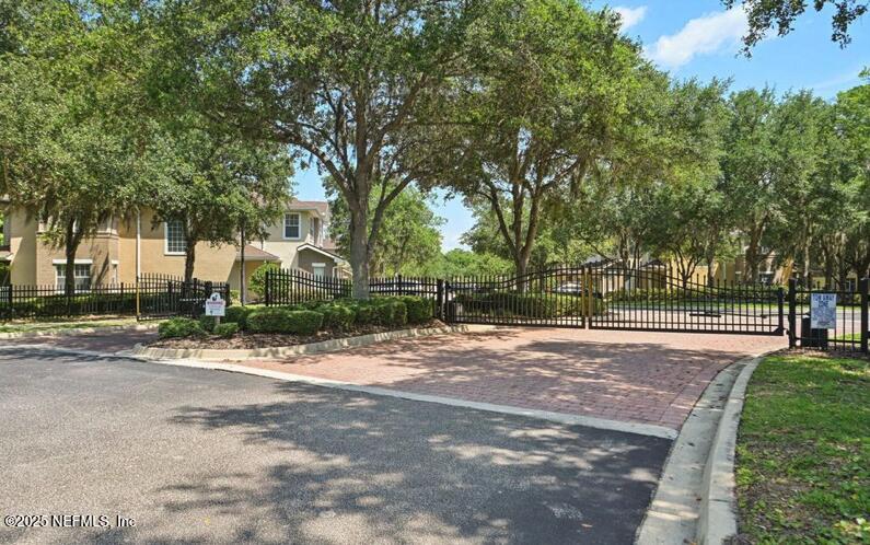 5663 Greenland Road, Unit 1004 Jacksonville, FL 32258 - Photo 30 of 35 a view of a street with a trees