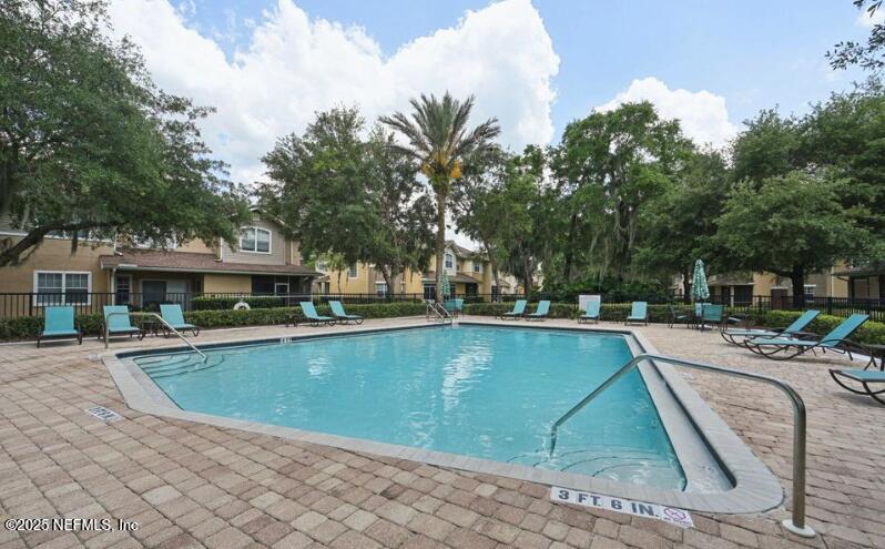 5663 Greenland Road, Unit 1004 Jacksonville, FL 32258 - Photo 33 of 35 a view of a swimming pool with lounge chair