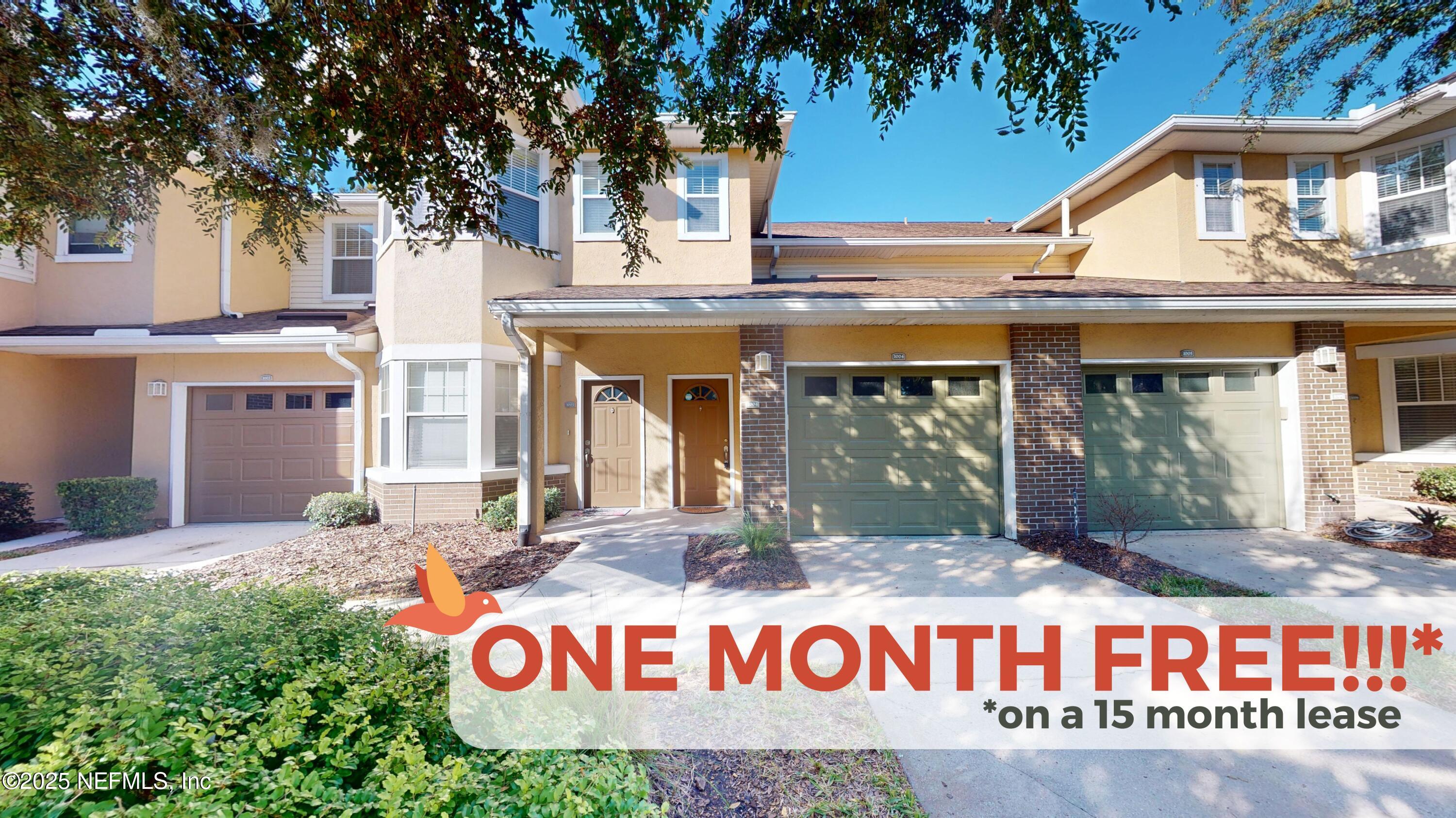 5663 Greenland Road, Unit 1004 Jacksonville, FL 32258 - Photo 34 of 35 a front view of multi story residential apartment building with yard