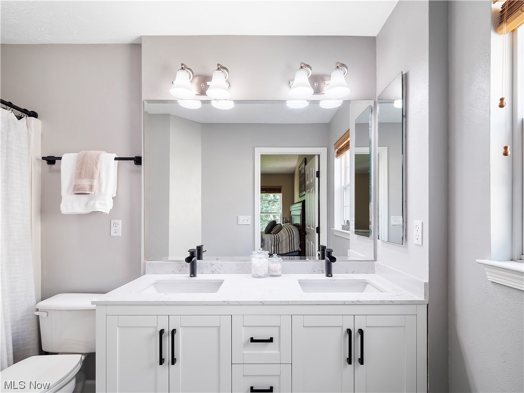 5319 Otten Road North Ridgeville, OH 44039 - Photo 19 of 33 Bathroom featuring dual large vanity and mirror