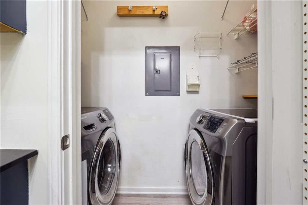 5641 Roswell Road, Unit 103 Atlanta, GA 30342 - Photo 12 of 27 a view of walk in closet with clothes and shoes