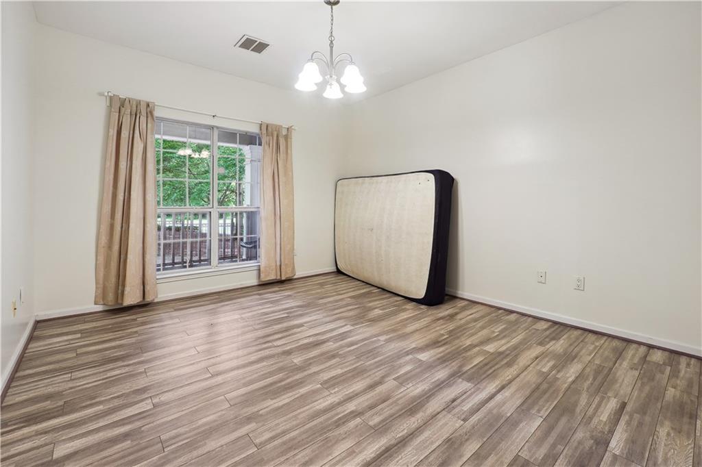 5641 Roswell Road, Unit 103 Atlanta, GA 30342 - Photo 13 of 27 a view of a livingroom with wooden floor
