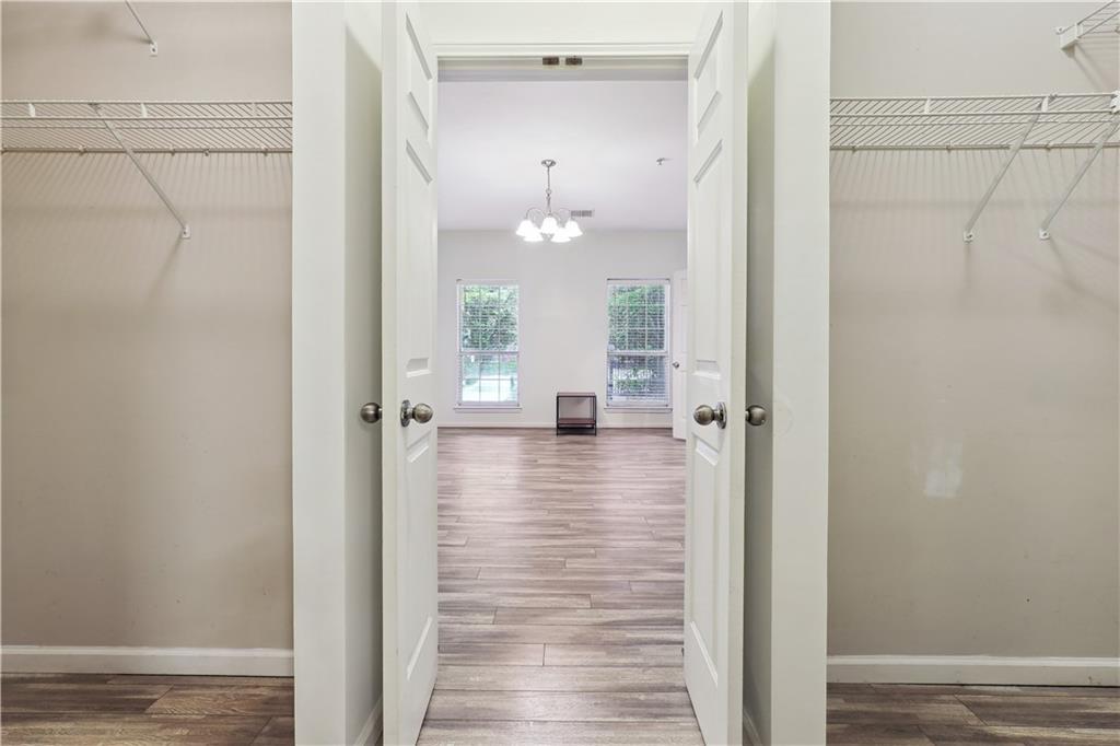 5641 Roswell Road, Unit 103 Atlanta, GA 30342 - Photo 20 of 27 a view of a hallway with wooden floor and staircase