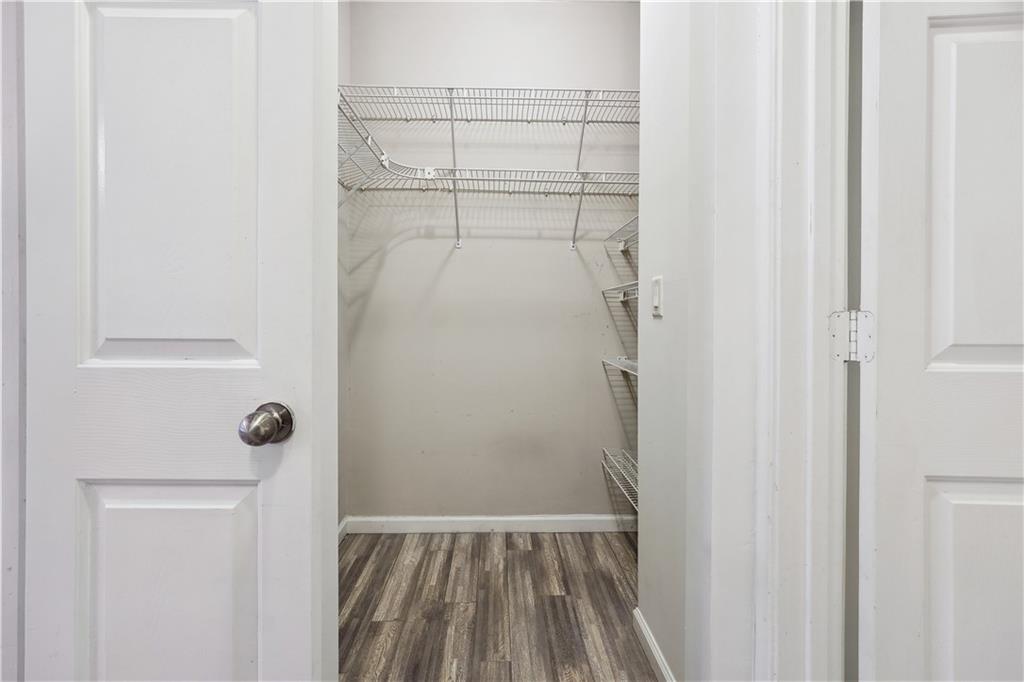 5641 Roswell Road, Unit 103 Atlanta, GA 30342 - Photo 21 of 27 a view of walk in closet with empty racks