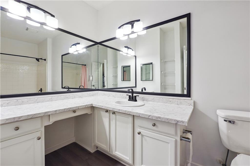 5641 Roswell Road, Unit 103 Atlanta, GA 30342 - Photo 23 of 27 a bathroom with a sink and a mirror