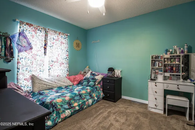 a bedroom with a bed and a bookshelf