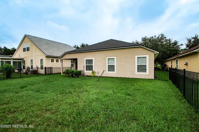 a view of a lake with a house in the background