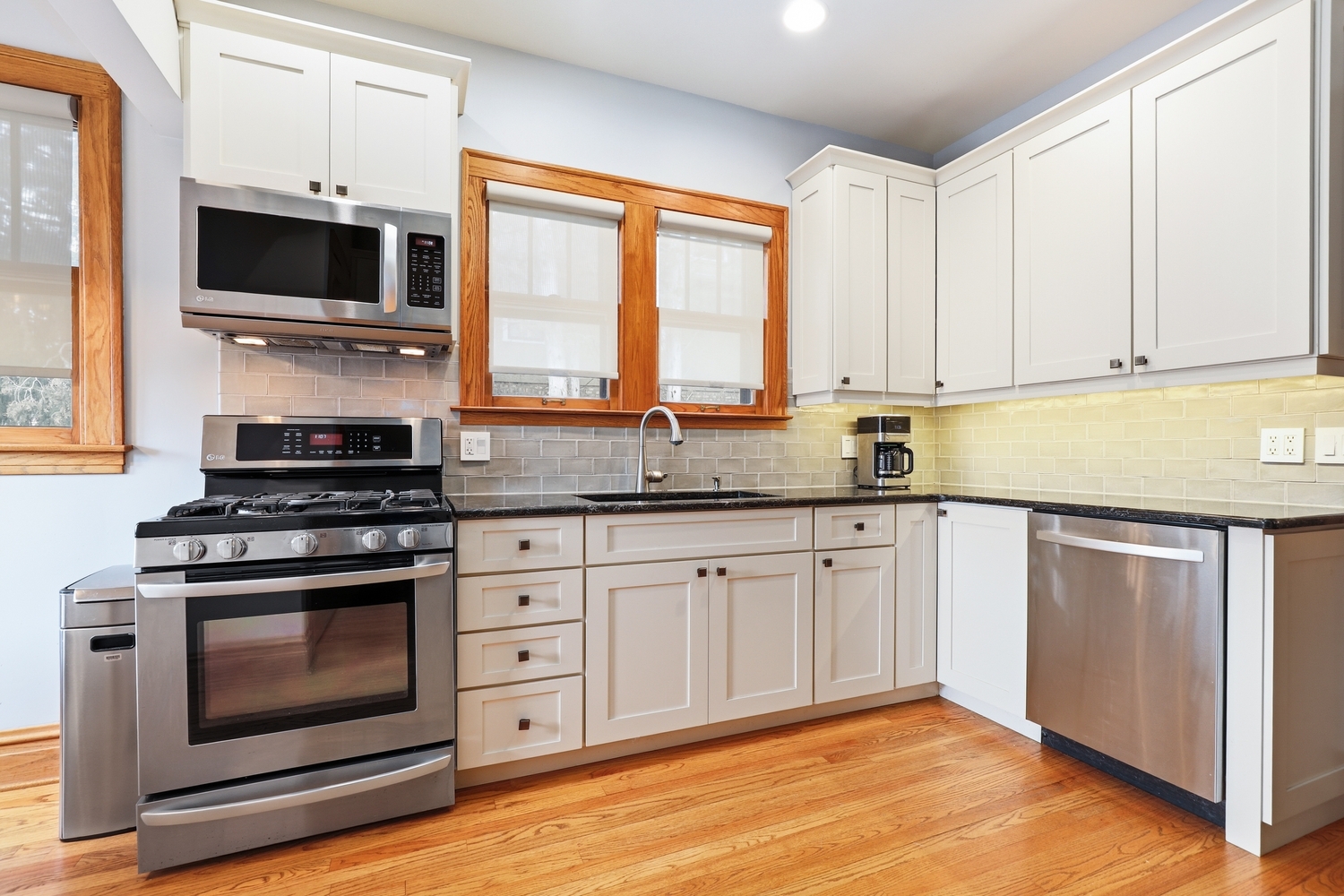 9031 Fairview Avenue Brookfield, IL 60513 - Photo 11 of 35 a kitchen with stainless steel appliances a stove a sink and a microwave