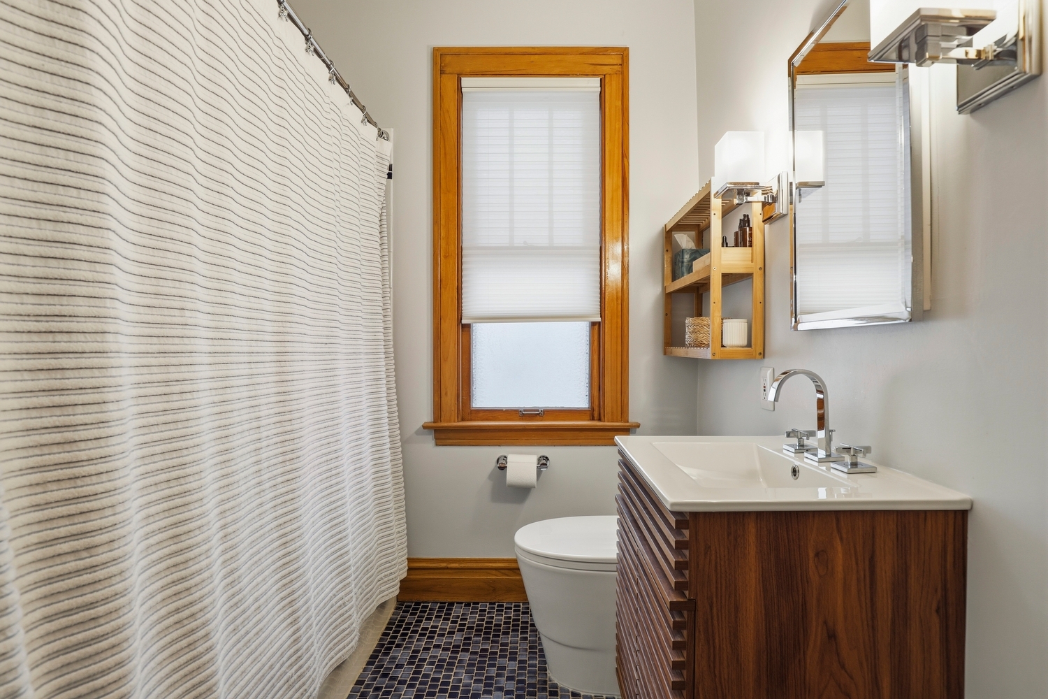 9031 Fairview Avenue Brookfield, IL 60513 - Photo 18 of 35 a bathroom with a sink a toilet and shower curtain