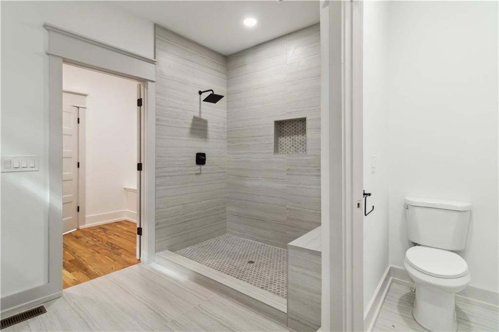 6121 Timberidge Drive Gainesville, GA 30506 - Photo 12 of 25 a bathroom with a shower and a toilet