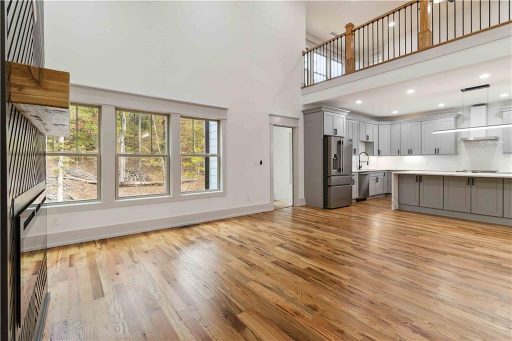 6121 Timberidge Drive Gainesville, GA 30506 - Photo 8 of 25 a view of kitchen and kitchen with furniture wooden floor and windows