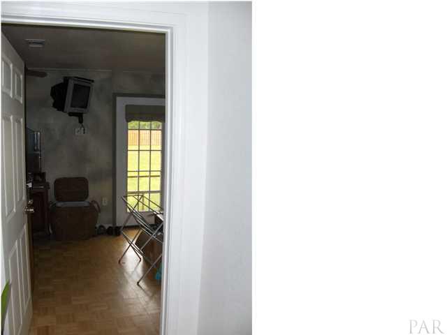 5424 Tom Sawyer Road Milton, FL 32583 - Photo 4 of 19 Master Bedroom...this room is larger than you can see here. French doors let you out to the property.