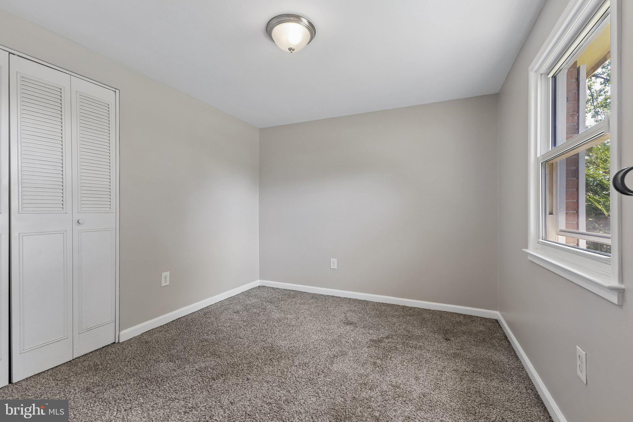 14197 Fullerton Road Woodbridge, VA 22193 - Photo 3 of 23 an empty room with windows