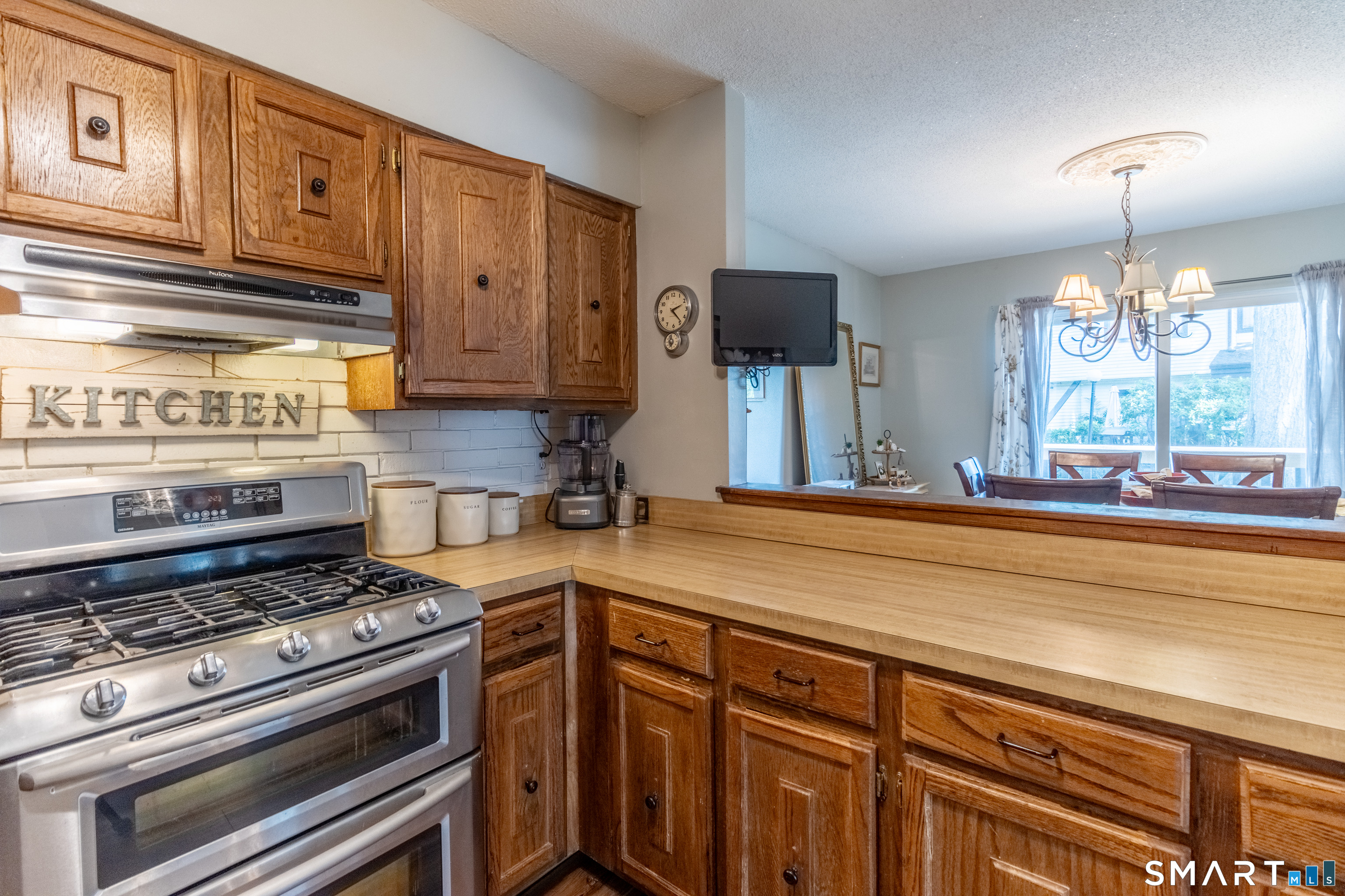 94 Cottonwood Road, Unit 94 Newington, CT 06111 - Photo 10 of 33 Full Kitchen with opening to Dining Area.