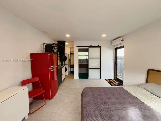 a bedroom with furniture and closet