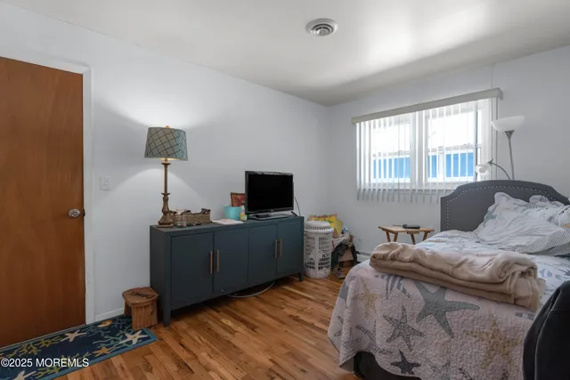 a bedroom with furniture and a window