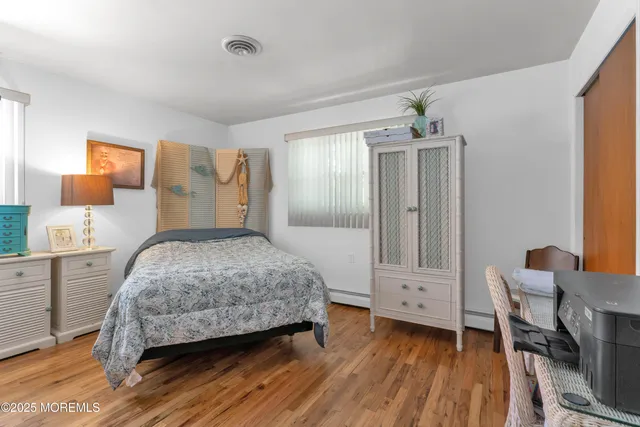 a bedroom with a bed and a table in it