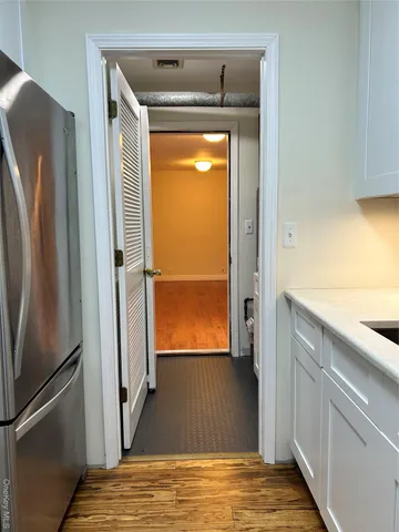 a kitchen with a stove and a refrigerator