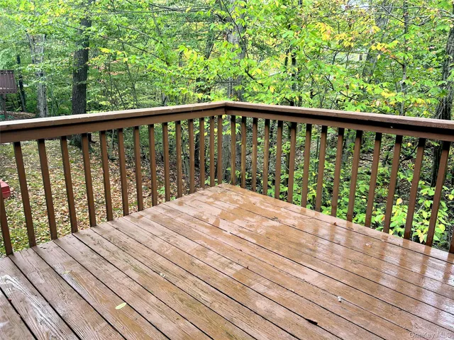 a reading room with furniture and a book shelf