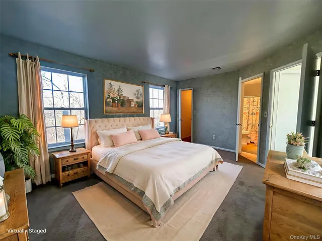 a view of a hallway with wooden floor and a window