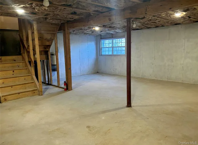 a view of a room with wooden floor and staircase