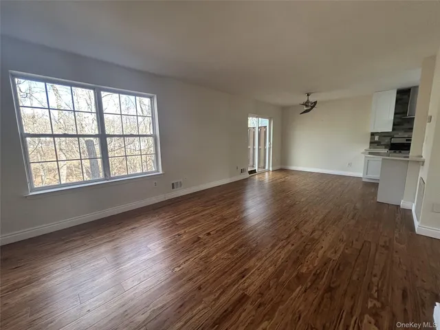 a view of an empty room with stairs
