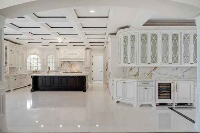 a kitchen with a stove a sink and a refrigerator
