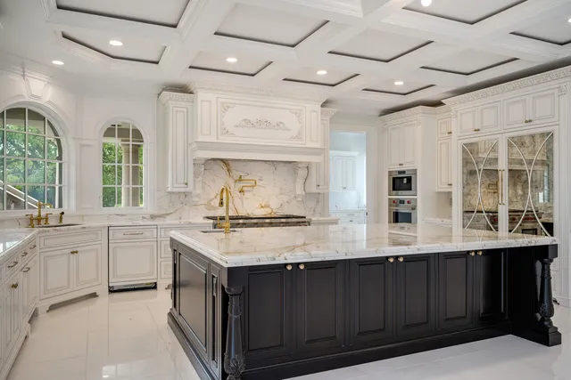 a view of a hallway with entryway and chandelier