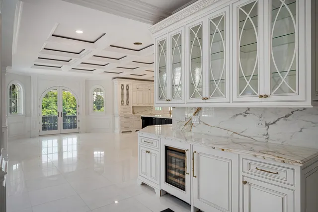 a bathroom with a tub a window and a shower