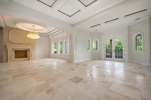 an aerial view of a house with a yard table and chairs