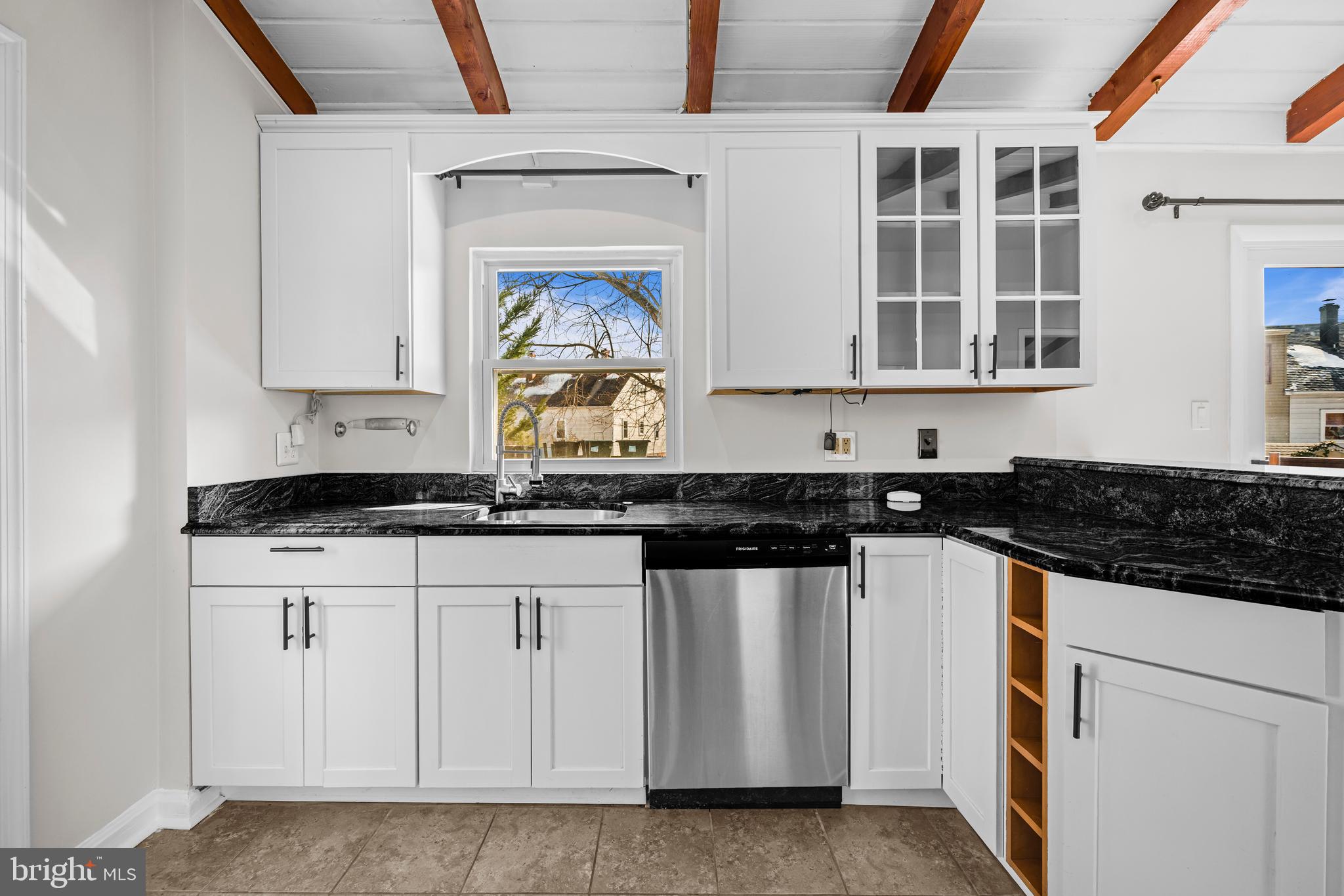 6813 Derrell Court Alexandria, VA 22307 - Photo 14 of 34 a kitchen with stainless steel appliances granite countertop a stove and a sink