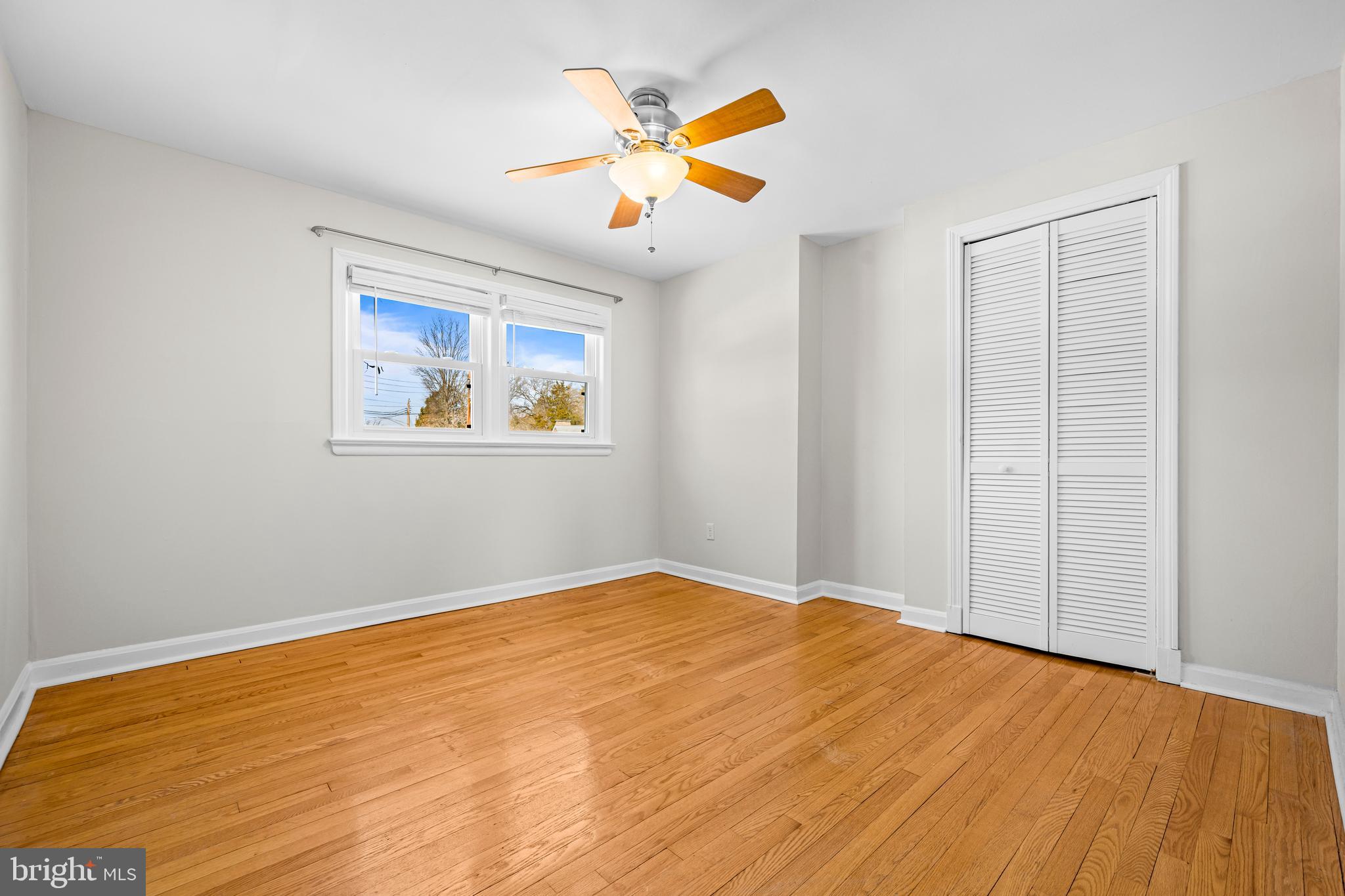 6813 Derrell Court Alexandria, VA 22307 - Photo 17 of 34 a view of an empty room with window and wooden floor