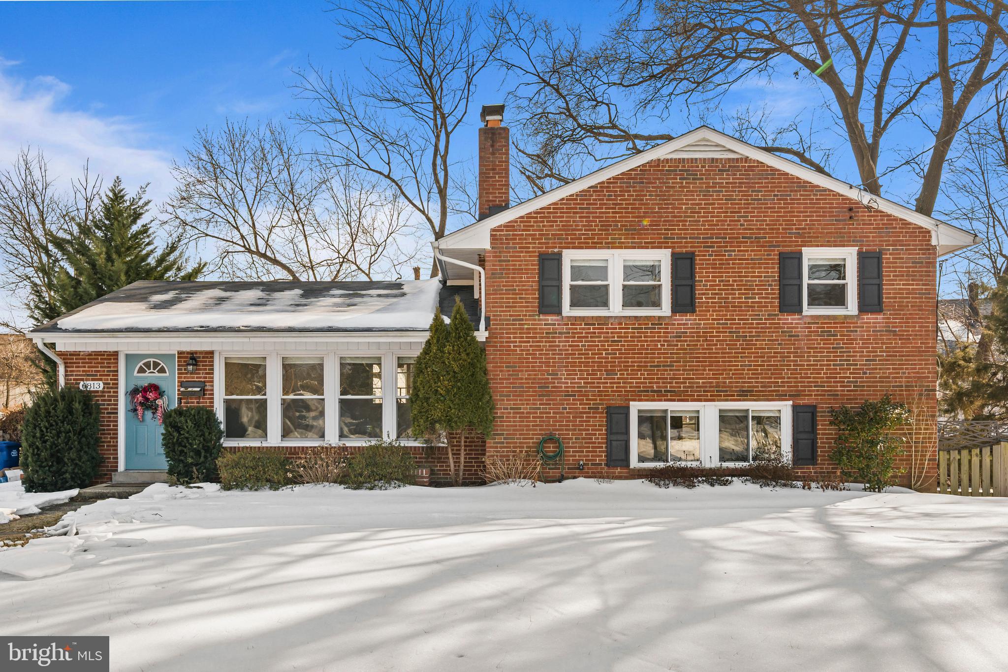 6813 Derrell Court Alexandria, VA 22307 - Photo 2 of 34 a front view of a house with a yard
