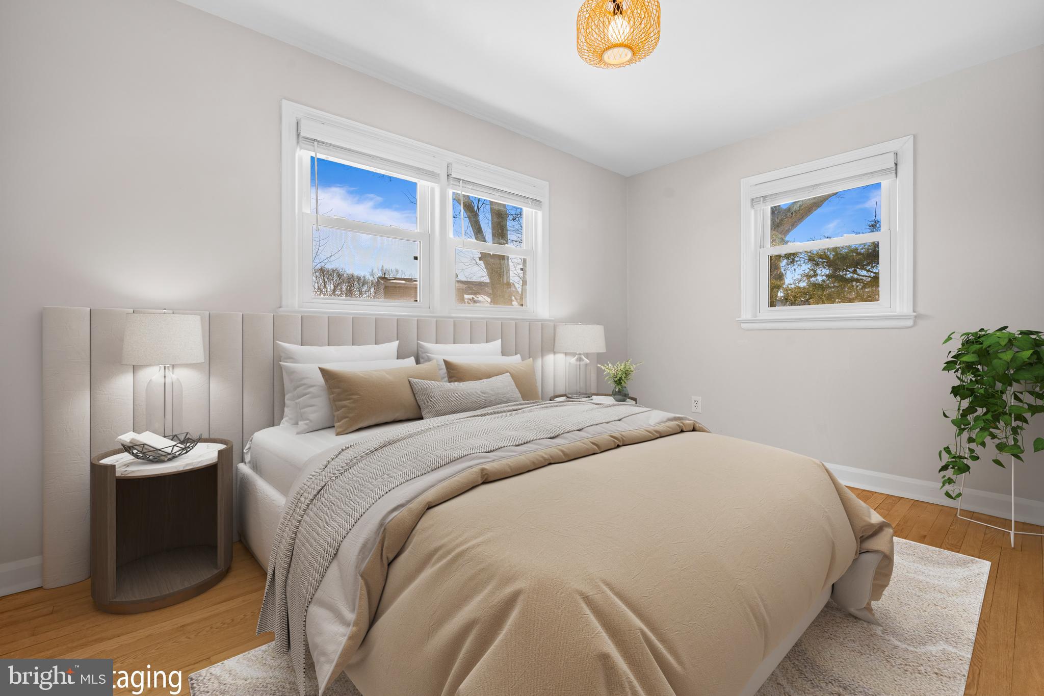 6813 Derrell Court Alexandria, VA 22307 - Photo 23 of 34 a bedroom with a bed and a painting on the wall