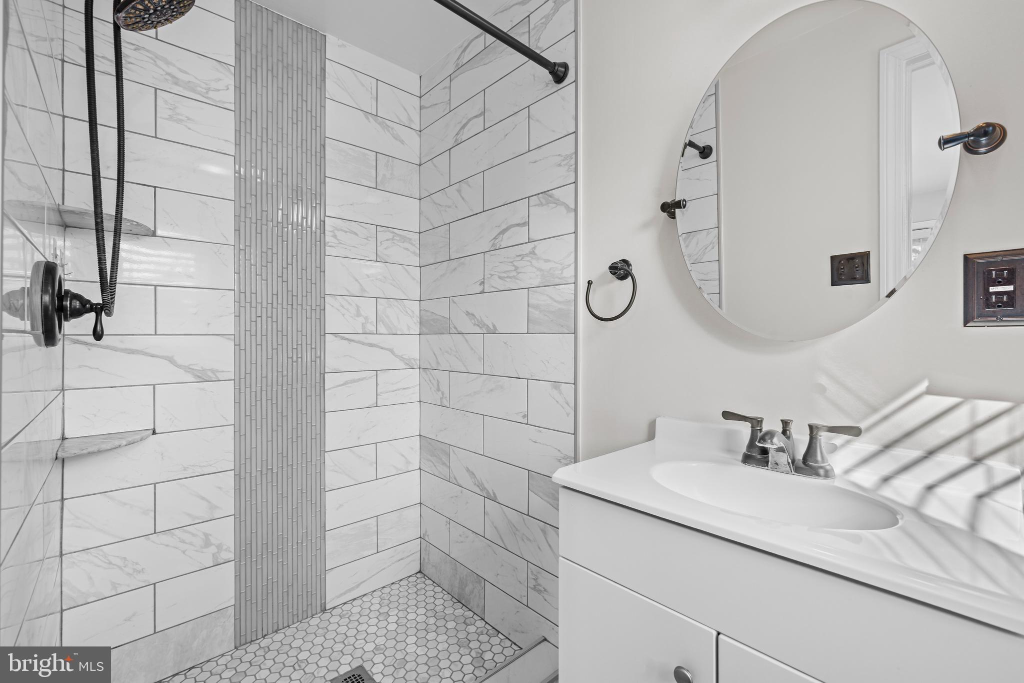 6813 Derrell Court Alexandria, VA 22307 - Photo 26 of 34 a bathroom with a sink and a mirror