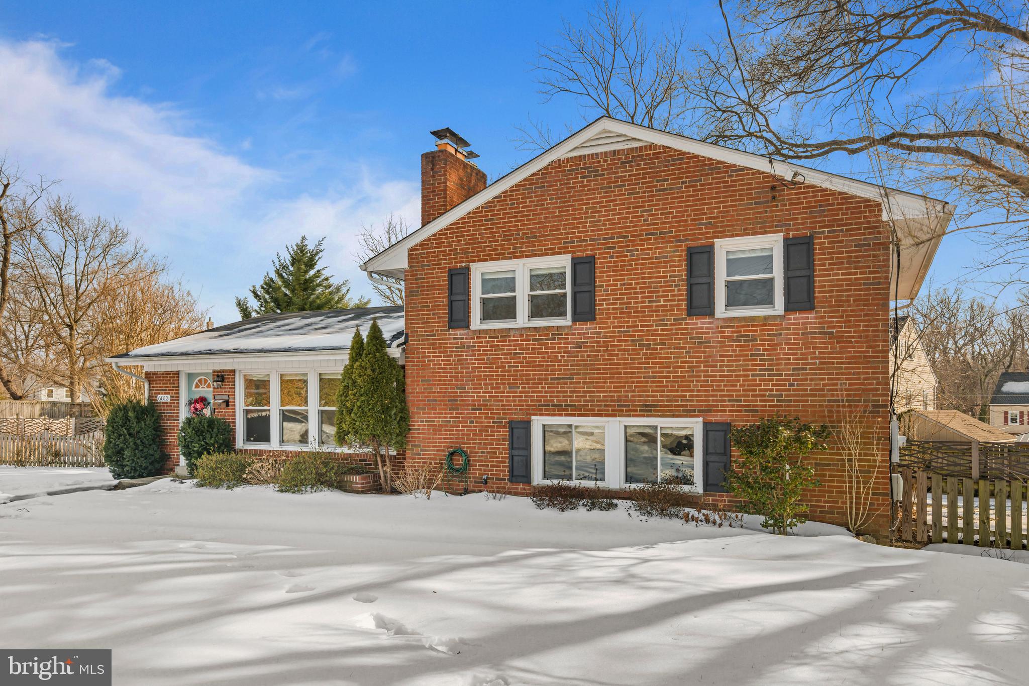 6813 Derrell Court Alexandria, VA 22307 - Photo 3 of 34 a front view of a house with a yard