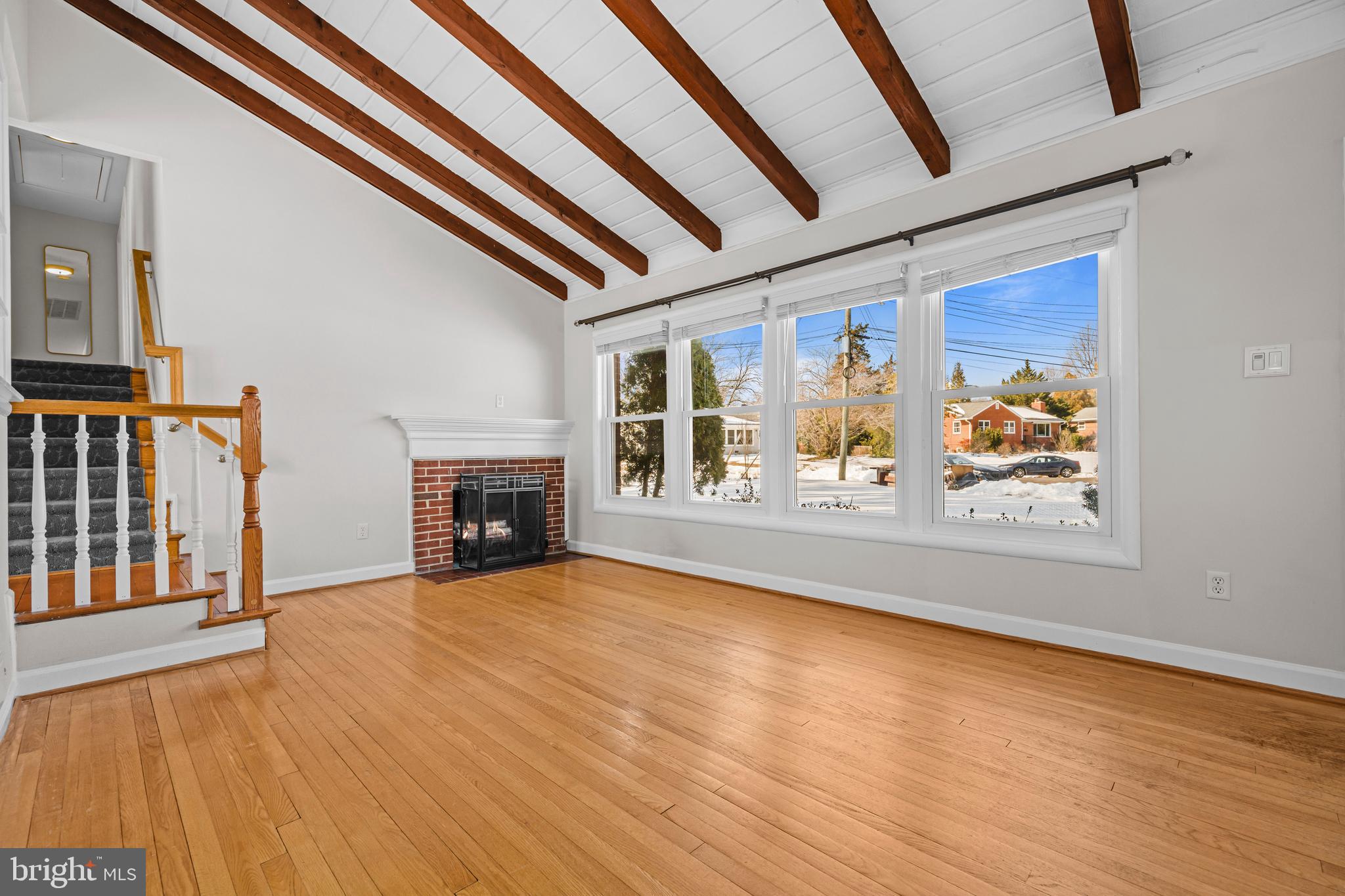 6813 Derrell Court Alexandria, VA 22307 - Photo 4 of 34 a view of an empty room with window wooden floor and front door