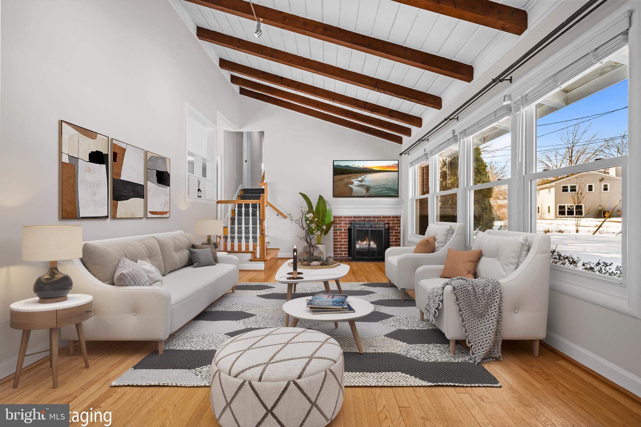 6813 Derrell Court Alexandria, VA 22307 - Photo 5 of 34 a living room with furniture fireplace and a flat screen tv