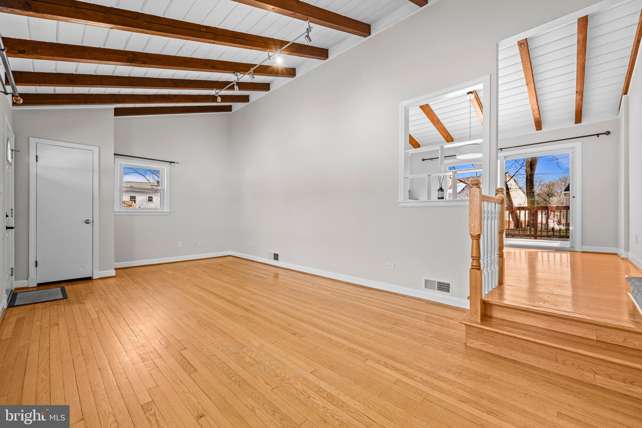 6813 Derrell Court Alexandria, VA 22307 - Photo 7 of 34 an empty room with wooden floor and windows