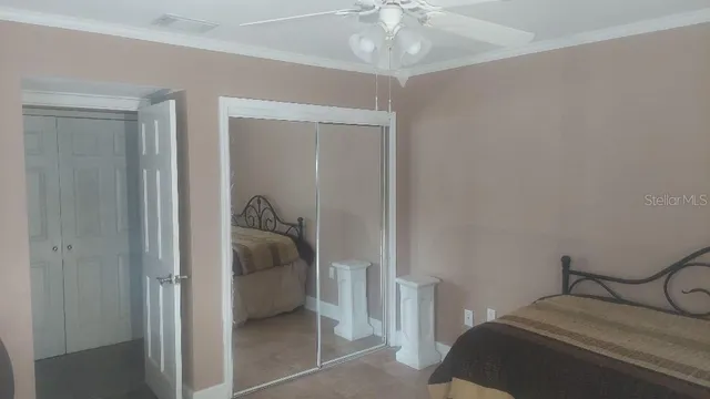 a bedroom with a bed and a view of bedroom