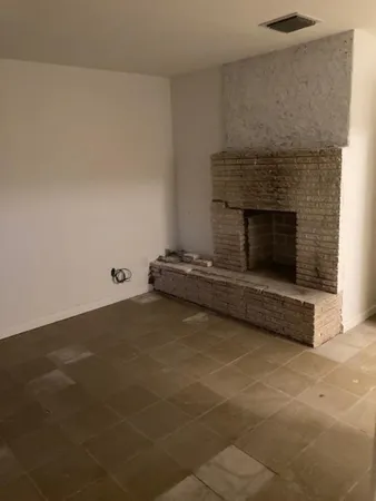 a living room with a fireplace