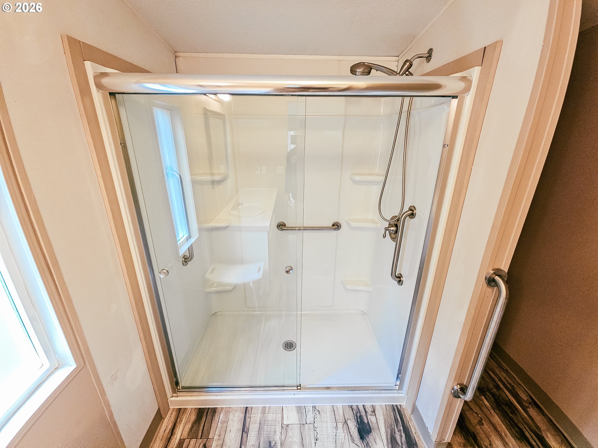 295 Easy Street Road Silverlake, WA 98645 - Photo 15 of 42 view of walk in closet with wooden floor and window